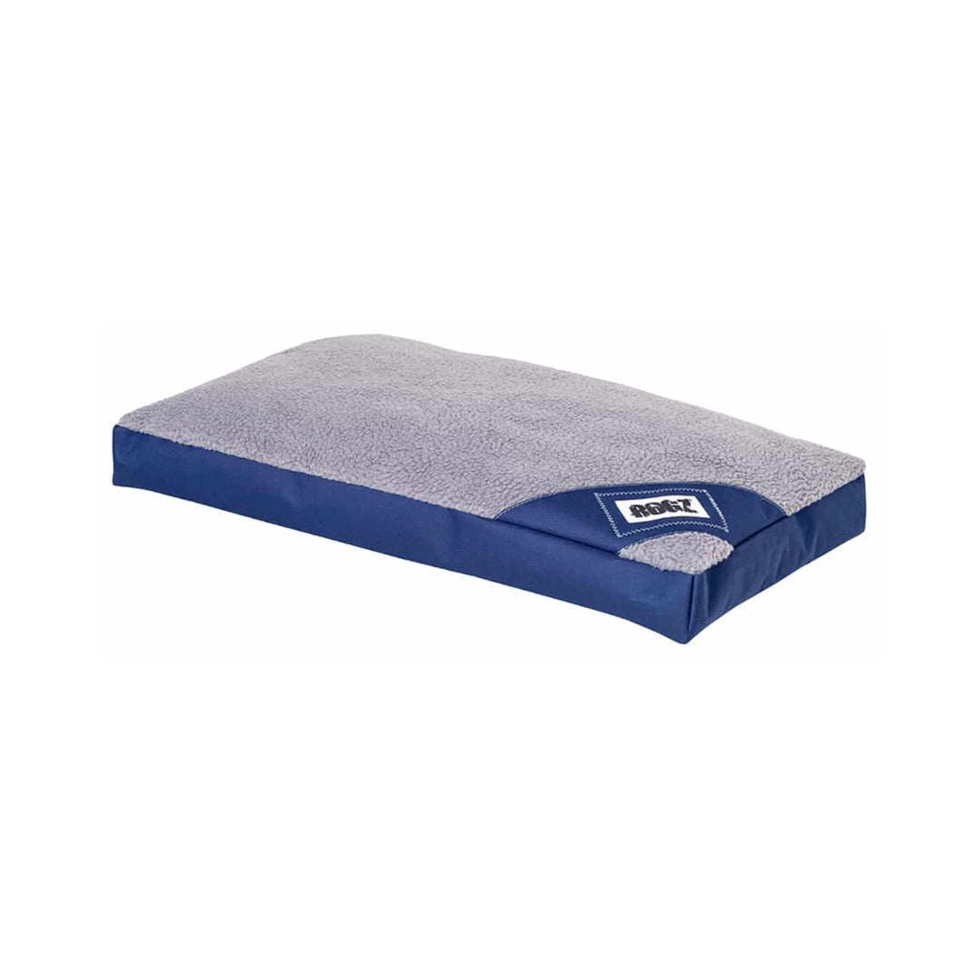 A flat, rectangular, reversible dog bed with a grey upper surface and a blue underside, featuring a carry handle.