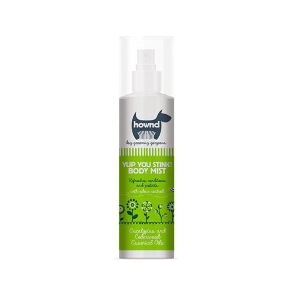 Hownd Yup You Stink! Dog Body Mist - A bottle of dog body mist surrounded by a happy dog with a clean coat.