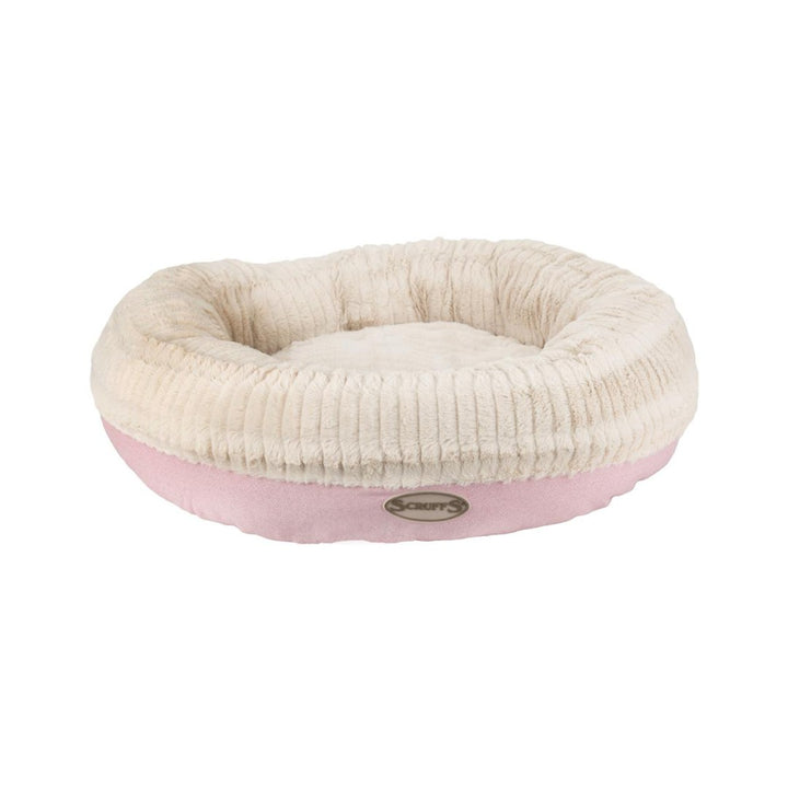 Scruffs Ellen Donut Dog Bed combines stylish design, plush comfort, and eco-friendly features with recycled polyester filling. The machine washable design adds practicality for pet owners.Pink