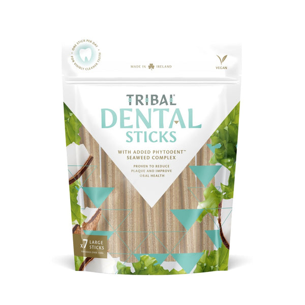 Happy large dog enjoying Tribal Dental Sticks Large Dog Treats.